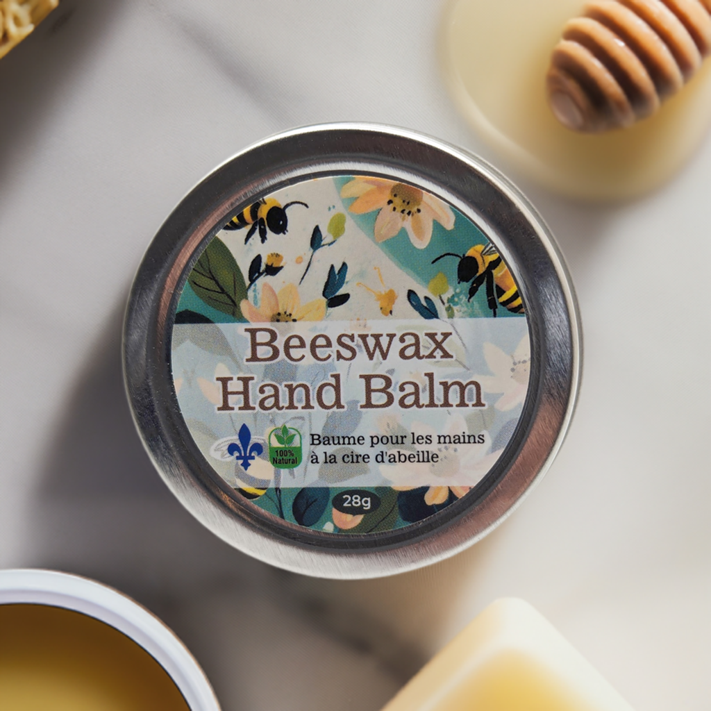 A tin container of Beeswax Balm: Moisturizer for lips, hands, feet and skin by Mielbrut.com is centered in the image, with its flower and bee-themed label visible. The background features an assortment of beeswax and honey items, including a honey dipper. The text on the label is in English and French.