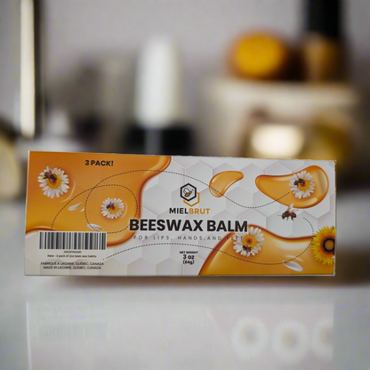 The image features Mielbrut.com's "3 pack beeswax balms for your lips and skin," known for boosting skin hydration. The package displays honeycomb patterns, daisies, and bees with "3 Pack!" highlighted. Net weight: 1.7 oz (48 g), set against a blurred backdrop.