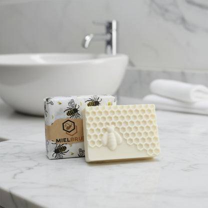 Square block of white soap with honeycomb pattern in an elegant modern bathroom countertop